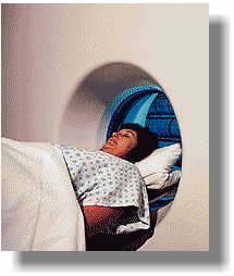 A CT scanner uses X-Rays to build up a picture of the patient.
